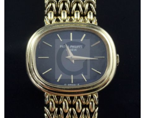 A lady's late 1970's 18ct gold Patek Philippe Calatrava wrist watch, with blue dial, ref. no. 4465/001, movement no. 1394373,