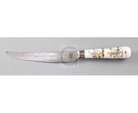 A Mennecy Kakiemon style porcelain handled knife, c.1740-60, painted with a Chinese figure amid flowers and rockwork, unmarke