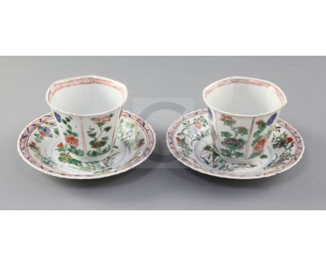 Two Chinese famille verte hexagonal cups and a pair of similar saucers, Kangxi period, each painted with panels of florals sp
