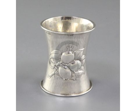 An Edwardian Arts & Crafts planished silver waisted napkin ring, by Omar Ramsden & Alwyn Carr, hallmarked London 1909, with i