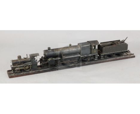 A scratchbuilt model of a 262 steam powered locomotive and tender, length 37in., and a similar model tank engine, with two fr