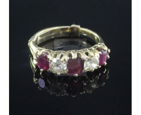 A gold and graduated five stone ruby and diamond set half hoop ring, set with oval, emerald and round cut stones, size K.