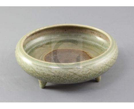 A Chinese Longquan celadon censer, Ming dynasty, 15th / 16th century, the compressed globular body incised with a band of dia