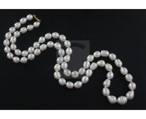 A modern single strand baroque pearl necklace with 18ct gold clasp, 83cm.From the estate of the late Sheila Farebrother.