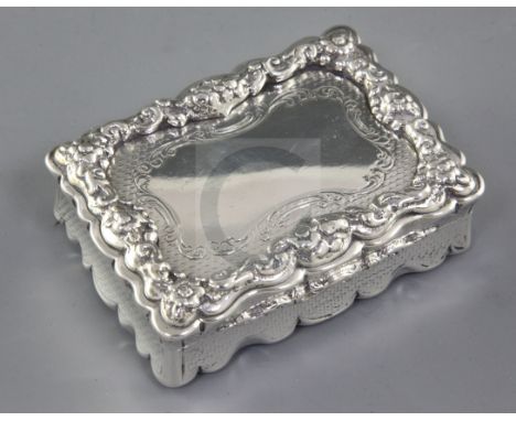 A Victorian silver rectangular table snuff box, by Yapp & Woodward, hallmarked Birmingham 1850, with cast and applied floral 
