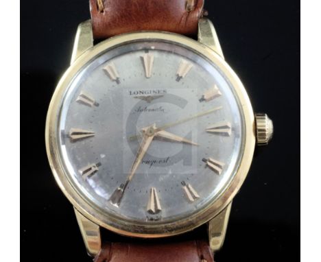 A gentleman's 1950's/1960's 18ct gold Longines Conquest automatic wrist watch, with arrowhead numerals, on later associated l