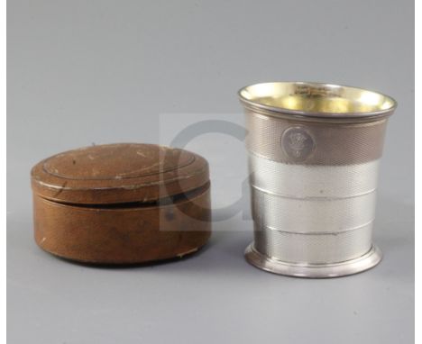 A cased Victorian engine turned silver travelling telescopic stirrup cup, by Robert Harper, retailed by Garrard & Co, London,