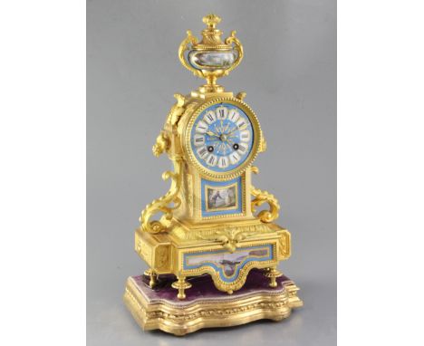 A mid 19th century French porcelain mounted ormolu mantel clock, Henry Marc, Paris, the foliate scroll breakfront case with b