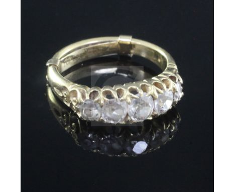 A late Victorian 18ct gold and graduated five stone diamond half hoop ring, size L.