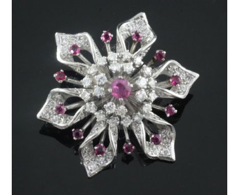 A platinum, ruby and diamond flowerhead brooch, 40mm.