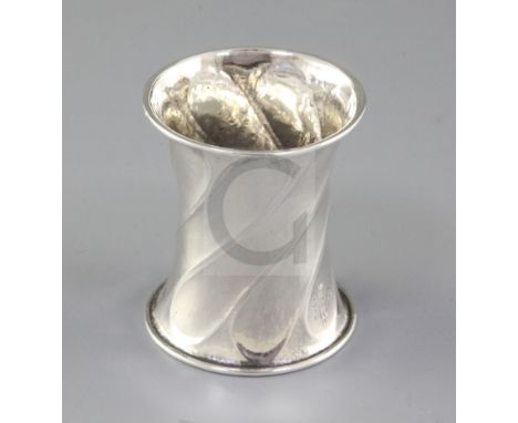 A George V Arts & Crafts planished silver waisted napkin ring, by Omar Ramsden, hallmarked London 1921, of waisted form, with