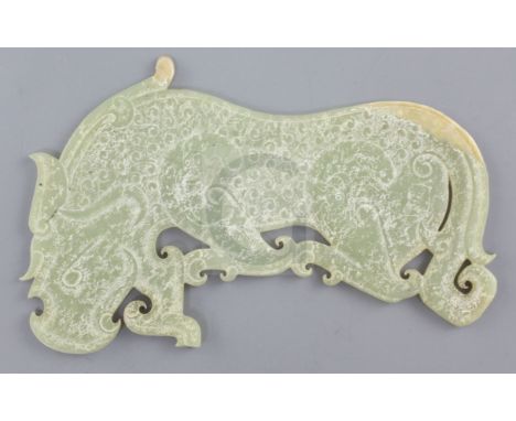 A Chinese archaistic yellow jade plaque, Eastern Zhou dynasty or later, in the form a mythical beast carved in relief with sp