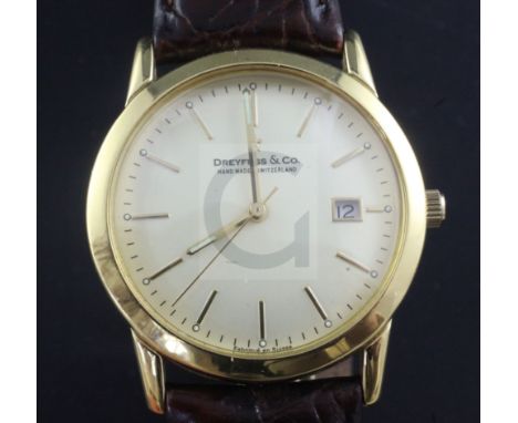 A gentleman's 18ct gold Dreyfuss & Co quartz wrist watch, with baton numerals and date aperture, on leather strap with gilded