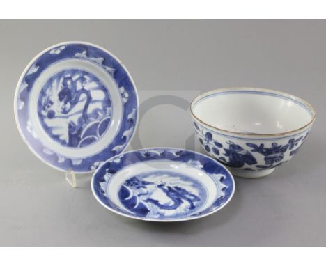 A Chinese Ming blue and white 'fish' bowl, 16th century and a pair of Kangxi leaping carp plates, the bowl painted with fish 