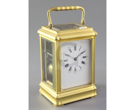 A late 19th century French gilt brass carriage clock, Margaine, the gorge case of characteristic form, with Roman and Arabic 