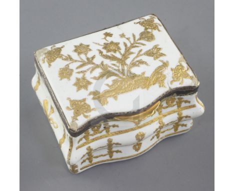 A late 18th / early 19th century French gilt metal mounted commode shaped white enamel snuff box, with tooled gilt floral dec
