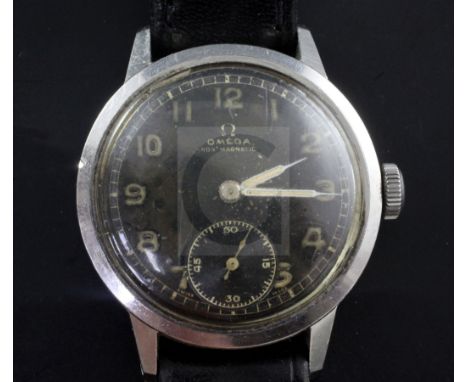 A gentleman's 1940's/1950's stainless steel Omega (non magnetic) manual wind wrist watch, with black Arabic dial and subsidia