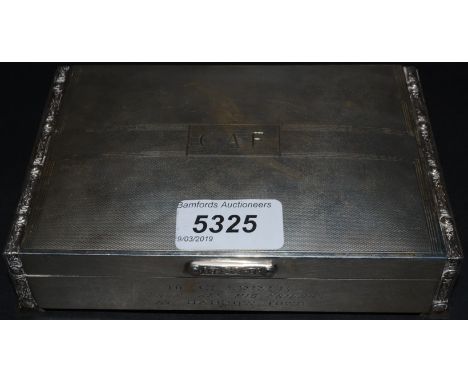 An early 20th century silver box, engine turned, Celtic borders and thumb piece