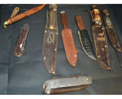 Knives - a William Rogers Sheffield leather scabbard belt knife; others; a Czechoslovakian folding utility knife, etc (8)