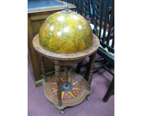 Drinks Globe, with a hinged top, on turned supports with under shelf. 