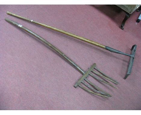 A XIX Century Rustic Hay Fork, having six tines, 148cm high, another farmers tool having iron scraper, both drilled. (2)