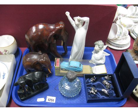 Silver Topped Glass Scent Bottle, two Nao figurines, carved elephants, Norev Citroen Dyane in box, six metal miniature animal