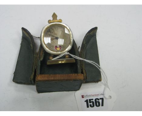 An Early XX Century Bedside Clock, the engine turned dial with Arabic numerals (feint) within mother of pearl frame, the move