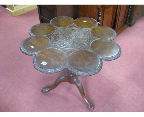 An XVIII Century Style Mahogany Supper Table, the top of eight circular discs with carved borders and foliate centre, on deta
