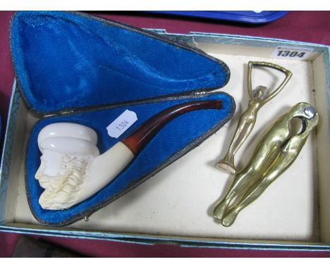 A Meerschaum Pipe, the bowl as a Turks head, in original case. Brass nutcrackers and bottle opener.