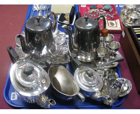 A Four Piece Electroplated Tea Service, of semi lobed form, hotel plate, egg cruet, cake dishes, etc:- One Tray