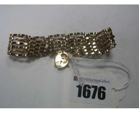 A 9ct Gold Gate Style Bracelet, of openwork design, to heart shape clasp.