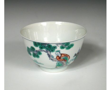A wucai tea bowl, six character mark of Kangxi, the exterior painted with a scholar by a pine tree watching two cranes by lin