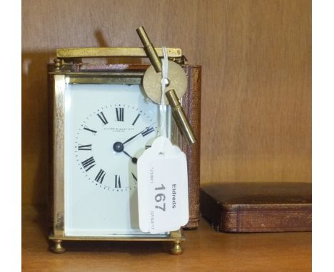 A brass-cased carriage clock with carrying handle, the enamel dial marked 'Winsor, Bishop & Co, Norwich', 13cm high overall, 