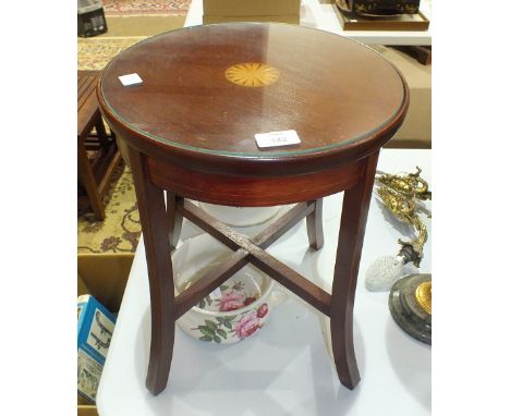 An Edwardian low mahogany circular-top occasional table with inlaid central shell motif, 35cm diameter, 46.5cm high, a Booth'