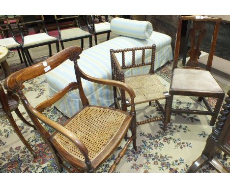 A stained wood bobbin-turned rush-seated corner chair, a Victorian cane-seated armchair and a Georgian dining chair, (3). 