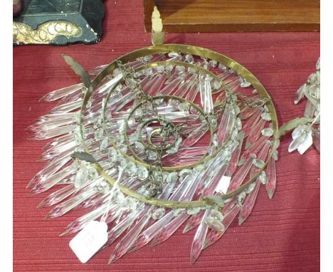 A brassed framed circular four-tier lustre drop ceiling light fitting, 26cm diameter and two similar smaller single-tier ligh