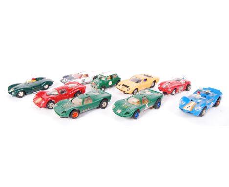 A collection of 9x vintage Scalextric slot racing cars. Comprising of; C16 Ferrari, AC Cobra, C91 Jaguar, Javelin, C17 Lambor