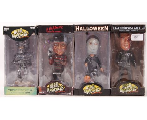 A collection of 4x Film / Horror related NECA made Head Knocker action figuers. All unused, within the original boxes. To inc