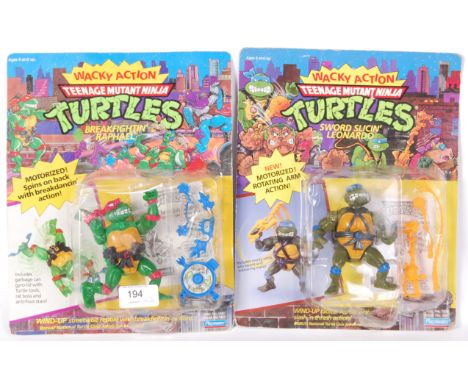 Two vintage Playmates made Teenage Mutant Ninja Turtles 'Wacky Action,' carded action figures. Breakfightin' Raphael and Swor