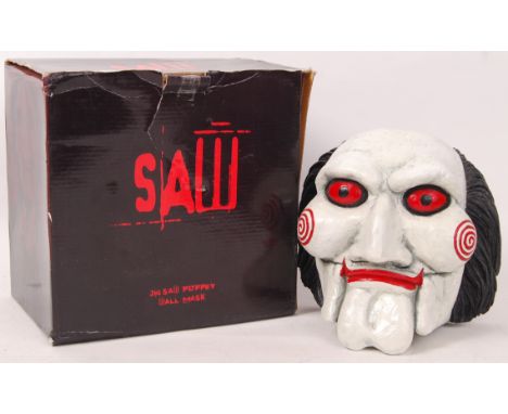 A Nemesis Now made replica ' Saw ' Jigsaw puppet Wall Mask. Within the original box. Detailed wall mask, hand painted. Rare. 