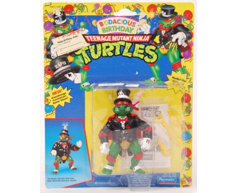 An original vintage Playmates Teenage Mutant Ninja Turtles 'Bodacious Birthday' carded 23 back action figure of Raphael, The 