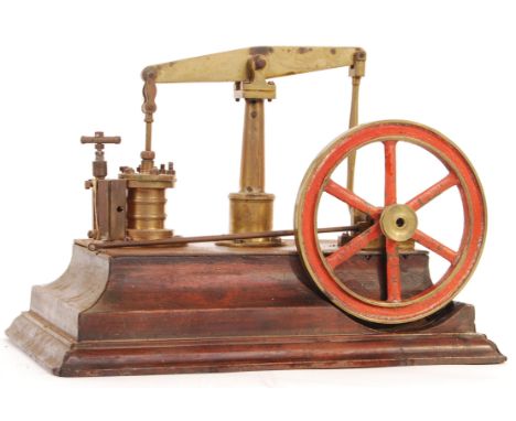 A vintage early - mid century possibly Stuart Turner made live steam beam engine. Brass construction, mounted on a wooden bas