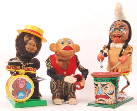 A collection of 3x vintage battery operated toys. Comprising of tinplate Indian Chief with drum, a Japanese made Cragstan Ind
