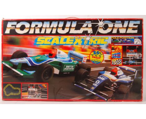 An original Scalextric boxed set ' Formula One ,' with both cars, appears complete within the original box. 