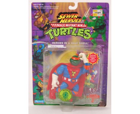 An original vintage Playmates Teenage Mutant Ninja Turtles 'Sewer Heroes' carded 82 back action figure of Super Mike & collec
