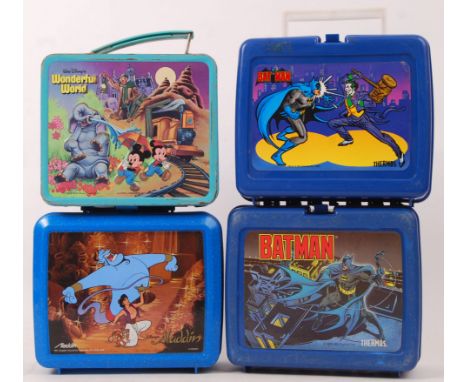 A collection of 4x vintage Lunchboxes. To include an Aladdin Industries tin lunch box ' Wonderful World ,' 2x Thermos Batman 