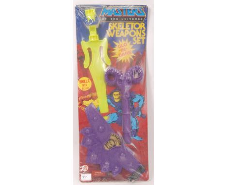 A rare Masters Of The Universe 1980's ' Skeletor Weapons Set ' with 'Glo-In-Dark' features. Factory sealed, within it's origi