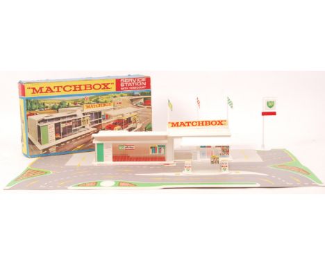 A vintage original Matchbox Lesney ' MG-1 ' BP Service Station With Forecourt. 100% complete, with pumps, flags and cardboard