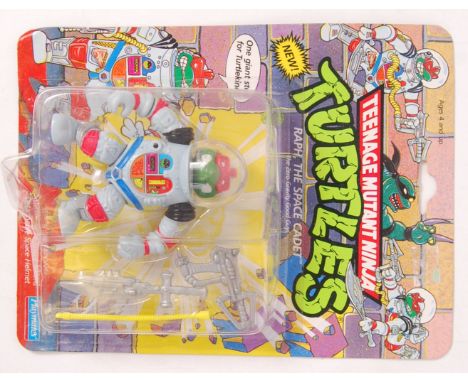 An original vintage Playmates Teenage Mutant Ninja Turtles carded 44 back action figure of Raph, The Space Cadet. The figure 