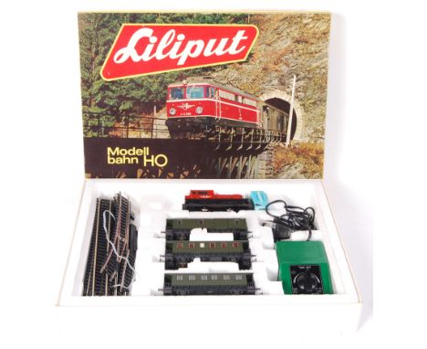 A vintage Liliput H0 / 00 gauge model railway trainset. '004 Personenzug'. Appears to be complete, within the original box. W